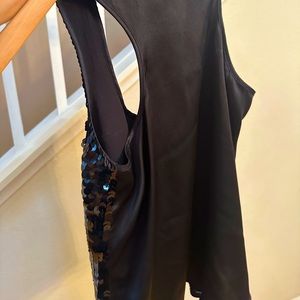 Black sequin sleeveless dressy top.